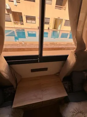 a view from the inside of a train with a window at Elegant City Apartment in Marrakech