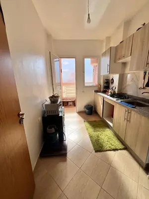 a kitchen with a sink and a counter top at Apartmen rentals with M Z in Oulad Akkou