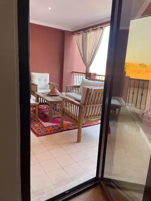 a living room with a couch and a table at Résidence Soltana in Marrakech