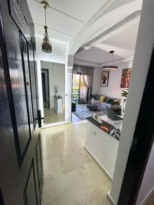 a living room with a couch and a table at Modern apartment with Atlas view in Marrakech