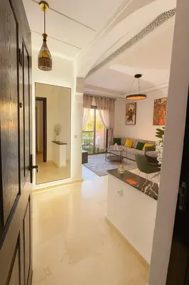 a living room with a couch and a table at Modern apartment with Atlas view in Marrakech