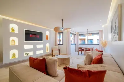 a living room with a couch and a table at Stylish Downtown Apartment Optical Fiber Included in Marrakech