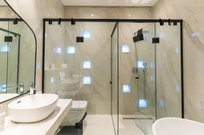 a bathroom with a shower and a sink and a toilet at Elegant Villa Free Breakfast Heated Pool Spa in Marrakech