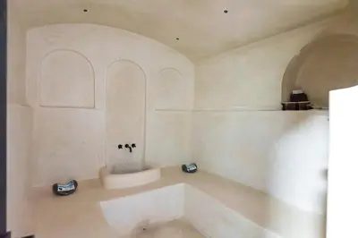 a white bath tub in a room with an arch at Elegant Villa Free Breakfast Heated Pool Spa in Marrakech