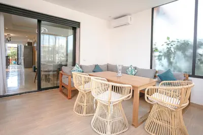 a dining room with a table and chairs at The Velvet Retreat - Marrakech in Marrakech
