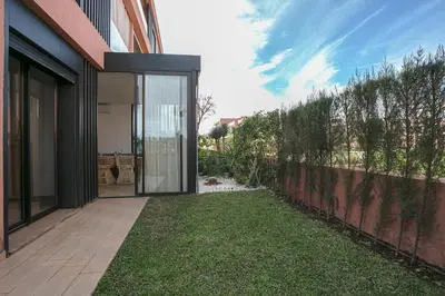 a house with a glass door leading to a yard at The Velvet Retreat - Marrakech in Marrakech