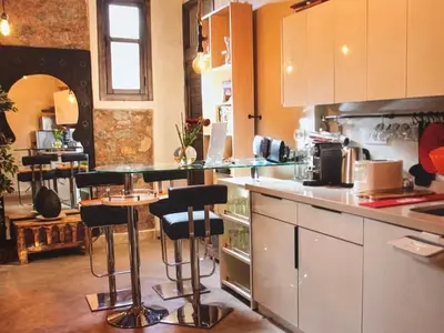 a kitchen with a counter and bar stools in it at Urban Escape in Marrakesh in Marrakech