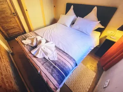 a bedroom with a bed with white sheets and pillows at Urban Escape in Marrakesh in Marrakech