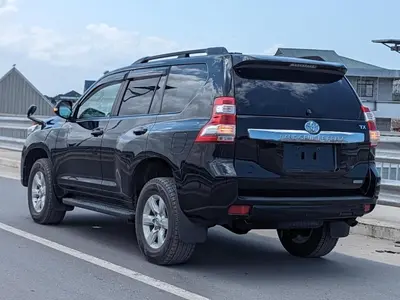 a black toyota fortuner parked on a highway at Menara Airport Transfers in Marrakech