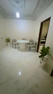 a room with a table and chairs and a mirror at Chic & Cozy Apartment in Marrakech
