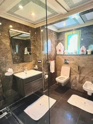 a bathroom with a toilet and a sink and a shower at Stylish Retreat in Marrakech