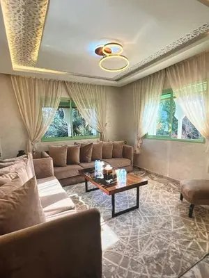 a living room with a couch and a table at Stylish Retreat in Marrakech