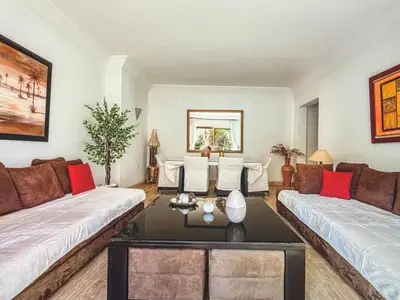 a living room with two couches and a table at Timeless Hideaway in Marrakech