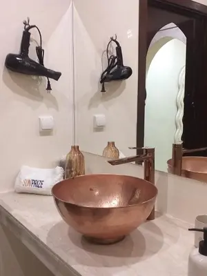 a bathroom with a bowl sink on a counter at Spacious studio with pool Guéliz in Marrakech