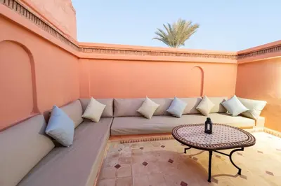 a living room with a couch and a table at Riad Marrakech 4-bedroom Riad in the heart of Marrakesh with Pool in Marrakech