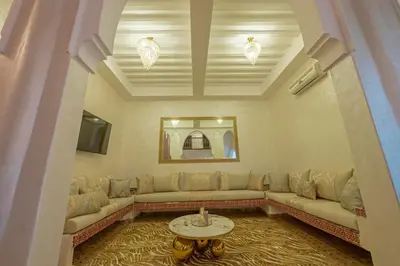 a living room with a couch and a table at Riad Marrakech 4-bedroom Riad in the heart of Marrakesh with Pool in Marrakech