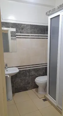 a bathroom with a toilet and a sink at Pied-à-terre Calme & Climatisé à 5 min du Centre in Marrakech