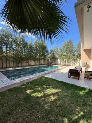 a swimming pool in the backyard of a house at Villa 60 Saphir in Marrakech