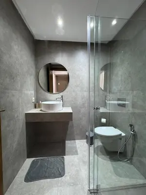 a bathroom with a sink and a toilet and a mirror at Villa 60 Saphir in Marrakech