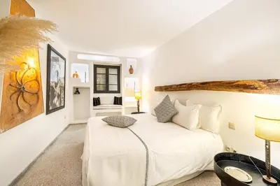 a bedroom with a white bed in a room at Riad Kenous - Exclusive&New -6 pax- Pool & Breakfast in Marrakech