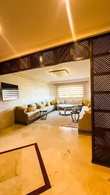 a living room with couches and a table at Marrakech Cozy Family Home piscine et wifi in Marrakech