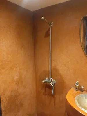 a shower stall in a bathroom with a sink at Riad Green Atlas in Marrakech