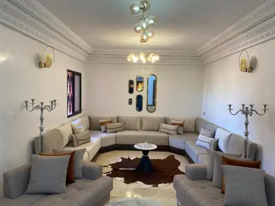 a living room with couches and a table at appartment L'Hivernage in Marrakech