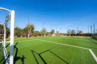 an empty soccer field with a soccer goal at 1 Bedroom Apartment with Private Garden, Terrace and Pool in Marrakech