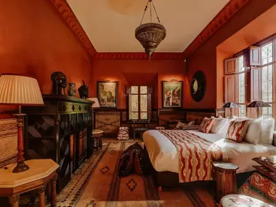 a bedroom with a large bed in a room at Casa Memoria in Marrakech