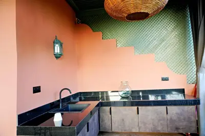 a kitchen with a sink and a staircase at Nassim Al Noor in Marrakech