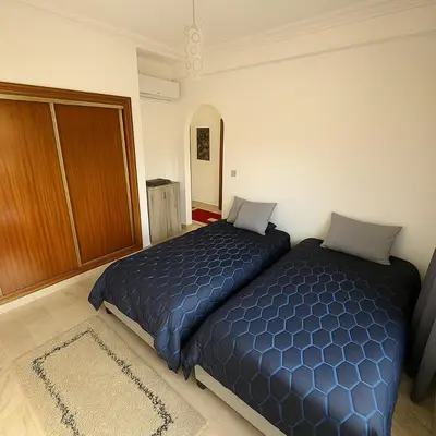 a bedroom with two beds in a room at Elegant cocoon in Guéliz with 2 bedrooms in Marrakech