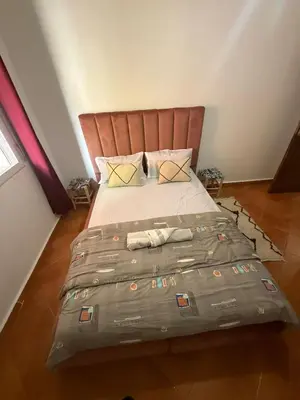 a bedroom with a large bed in a room at appartement Yasmine à Marrakech in Marrakech