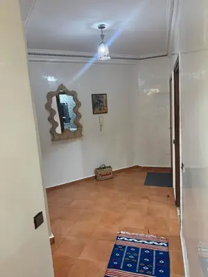 an empty room with a mirror and a hallway at appartement Yasmine à Marrakech in Marrakech