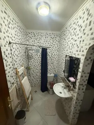a bathroom with a sink and a shower and a toilet at appartement Yasmine à Marrakech in Marrakech