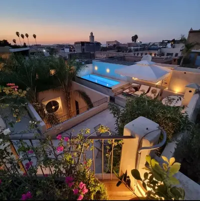 a view of a building with a swimming pool at RIAD Azur in Marrakech