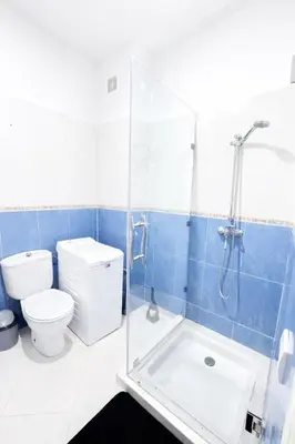 a bathroom with a toilet and a glass shower at Residence Nadia in Marrakech