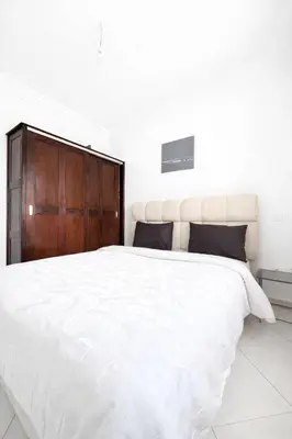 a white bedroom with a large white bed at Residence Nadia in Marrakech