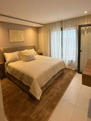 a bedroom with a large bed and a window at Luxury Town Center Gueliz 2 Chambres Parking Grande Terrasse in Marrakech