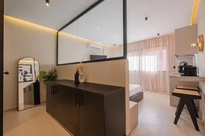 a bathroom with a black cabinet and a mirror at Studio elegant raffine pour un sejour tout confort in Marrakech