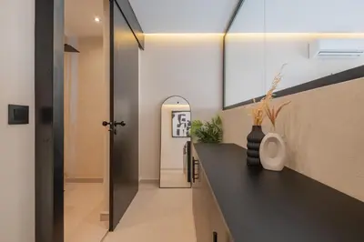 a hallway of a house with a black counter at Studio elegant raffine pour un sejour tout confort in Marrakech