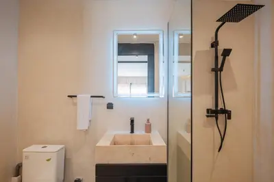 a bathroom with a sink and a toilet and a window at Studio elegant raffine pour un sejour tout confort in Marrakech