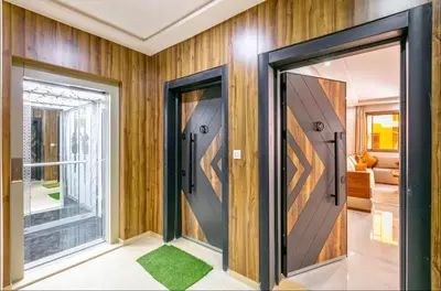 two doors in a room with wood paneling at Luxury 2-bedroom apartment in Marrakech