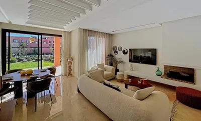 a living room with a couch and a table at Abwab in Marrakech