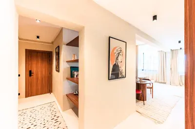 a hallway of a house with white walls at Suite Afra - Cinéma privé & Central in Marrakech