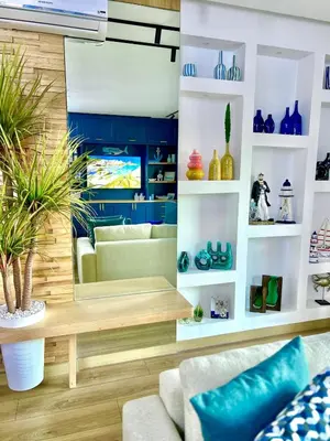 a living room with blue and white shelves at Appartement Marrakech Hivernage N28 RÉSIDENCE CAPRICE PALACE in Marrakech