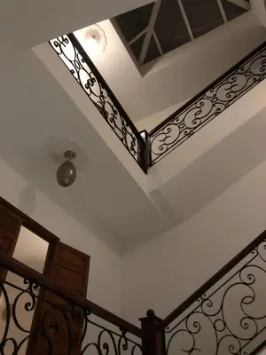 a staircase with wrought iron railings and a ceiling at Havre de Paix in Marrakech