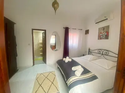 a bedroom with a bed with towels on it at Havre de Paix in Marrakech