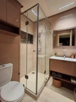 a bathroom with a shower and a toilet and a sink at Prestigia Agathe in Marrakech