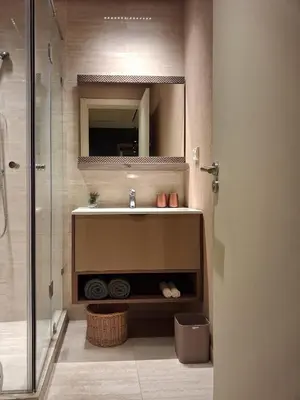a bathroom with a sink and a mirror at Prestigia Agathe in Marrakech