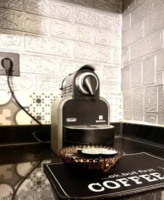 a coffee maker and a basket on a counter at Your Hidden Oasis, Quiet, Cozy and Charming in Marrakech